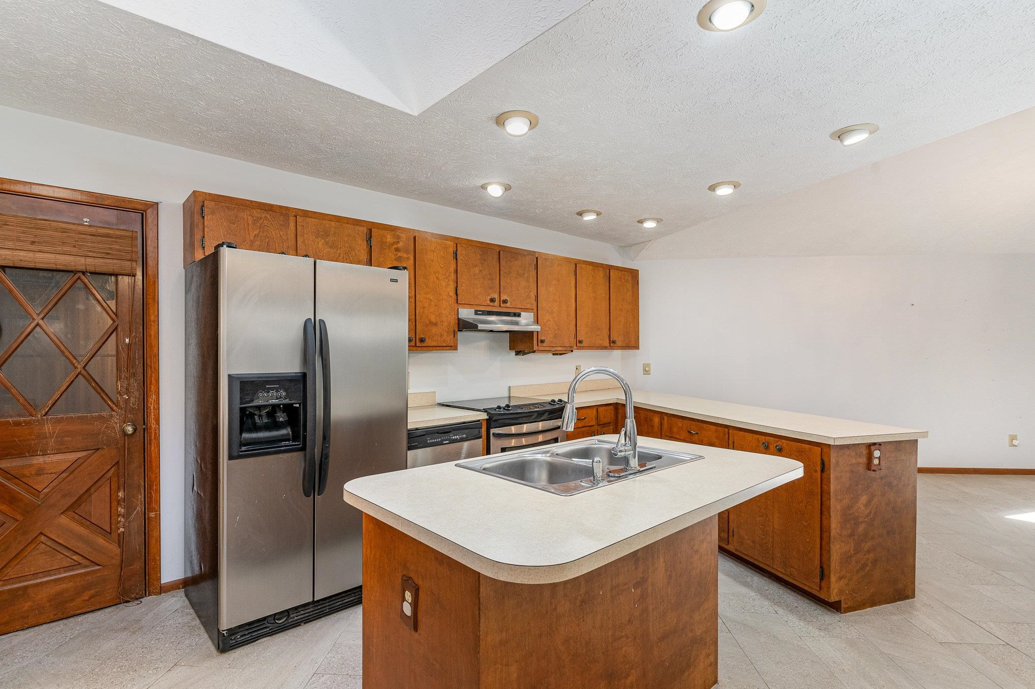 513 Argyll Drive Sanford, NC 27332 - Photo 9 of 31 a kitchen with stainless steel appliances a sink and refrigerator