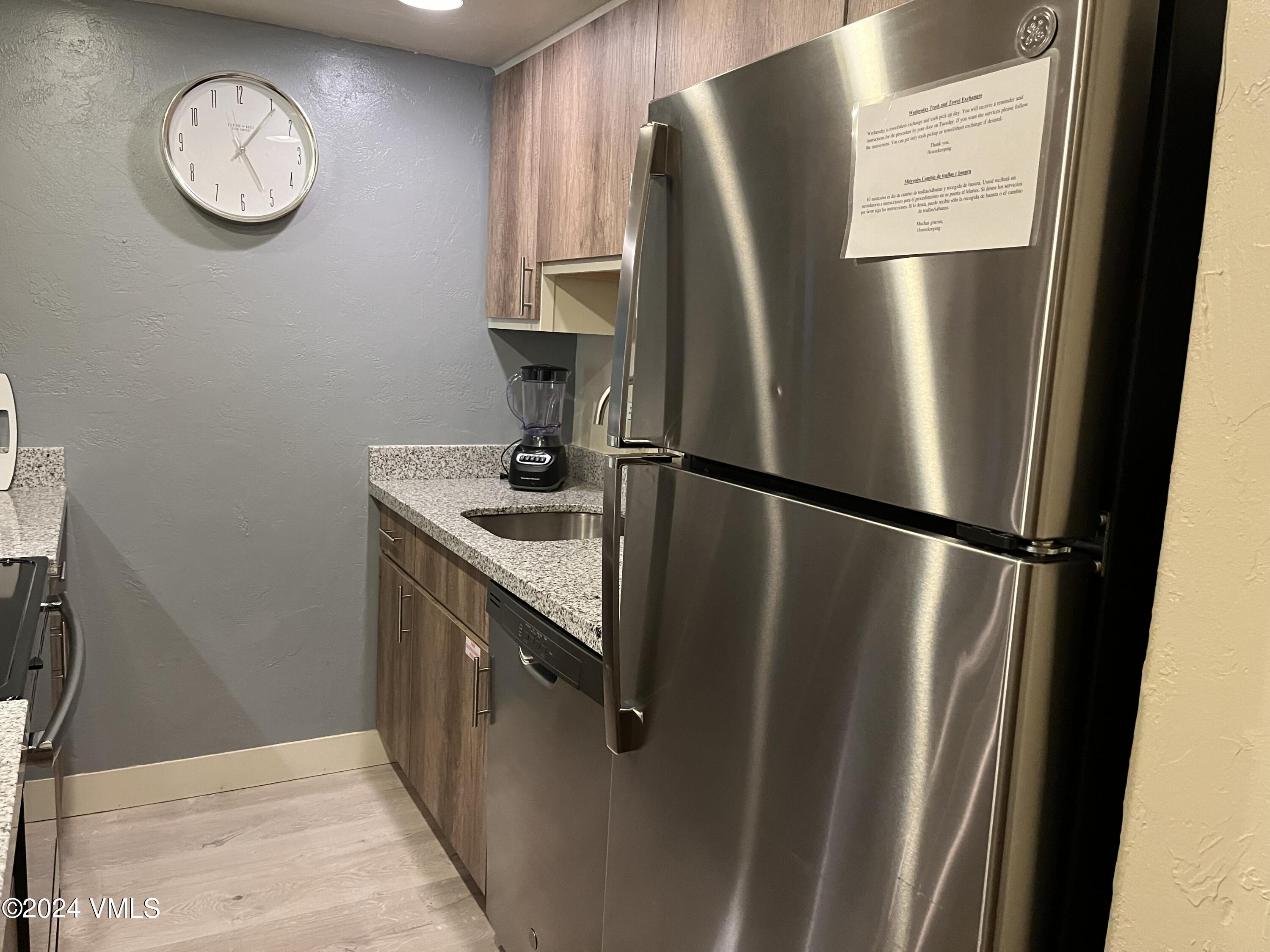 1020 Vail View Drive, Unit 131237 Vail, CO 81657 - Photo 20 of 20 a kitchen with metallic refrigerator and a sink