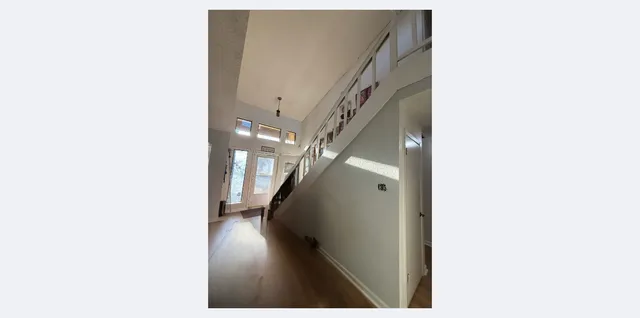 a view of a hallway with staircase