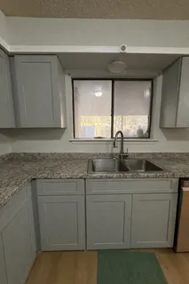 a kitchen with a sink and cabinets