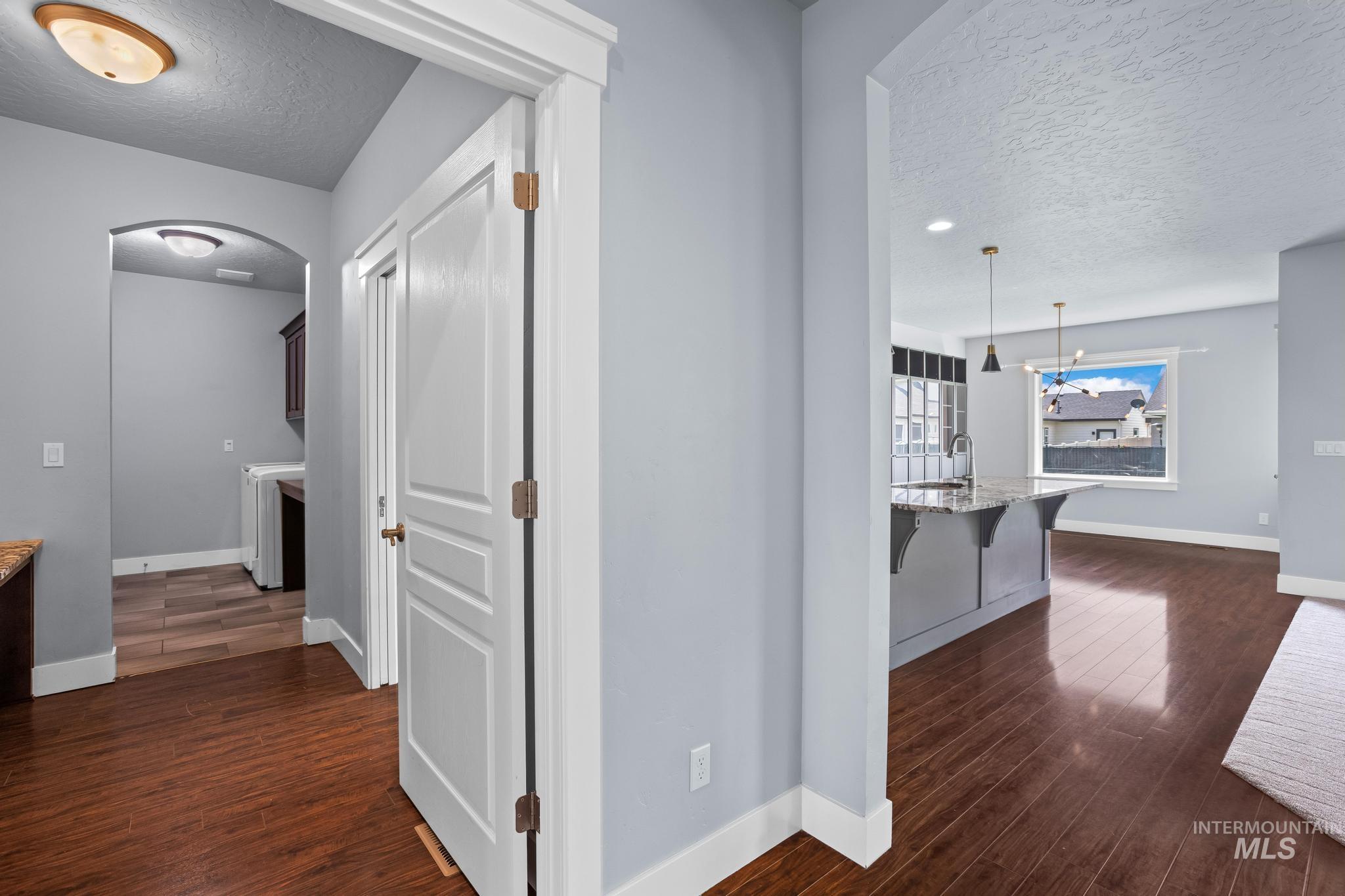 2681 East Rhyolite Court Nampa, ID 83686 - Photo 30 of 48 Open concept living space featuring rich wood-finish flooring