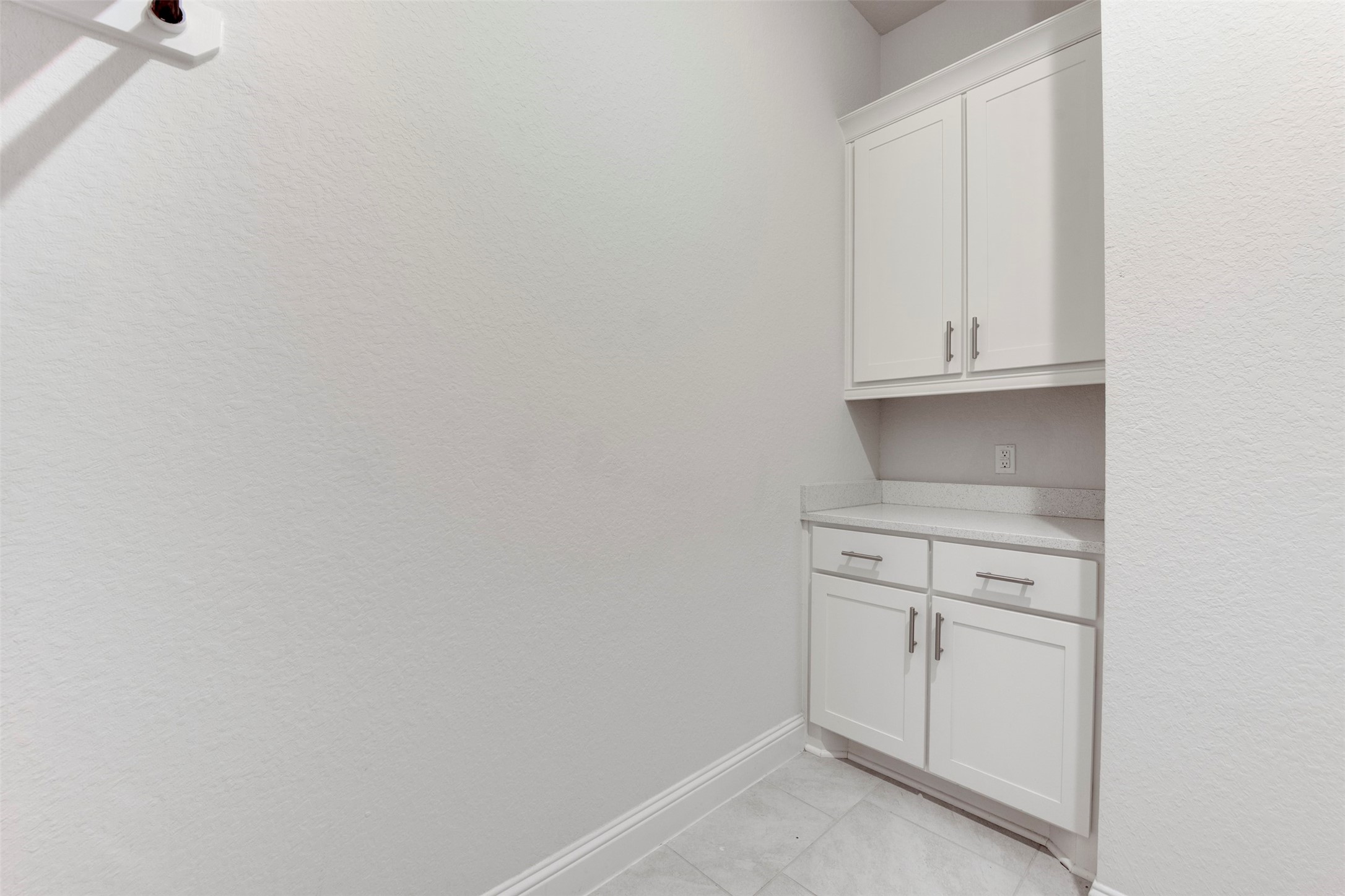 4802 Gingerwood Trace Lane Rosharon, TX 77583 - Photo 28 of 43 Concealed laundry room storage for a clean, organized look