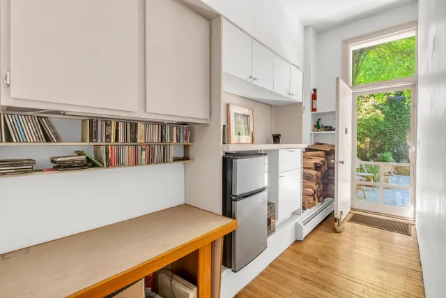 a view of kitchen with cabinets and wooden floor