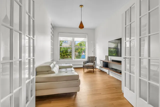 a living room with furniture or window and a wooden floor