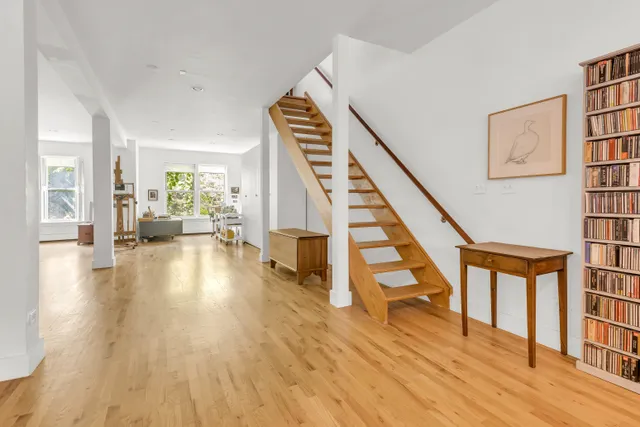 a view of an entryway with wooden floor