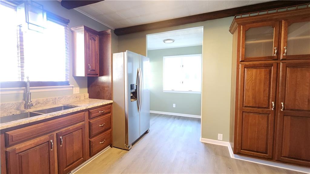 410 Longfellow Street Vandergrift, PA 15690 - Photo 12 of 25 a kitchen with a refrigerator and a sink