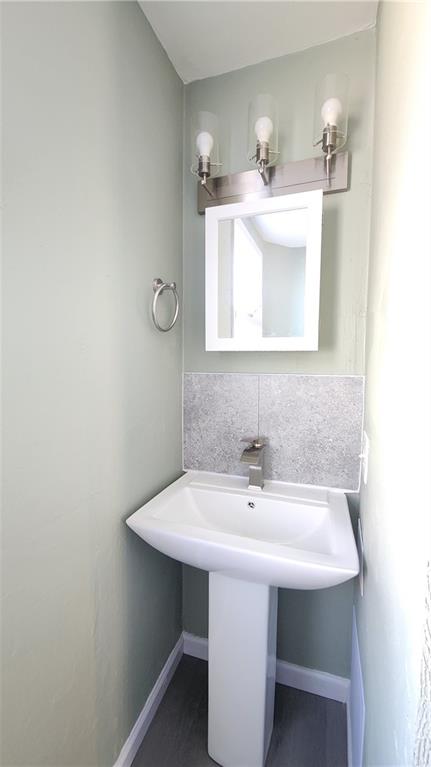 410 Longfellow Street Vandergrift, PA 15690 - Photo 16 of 25 a bathroom with a sink and a mirror