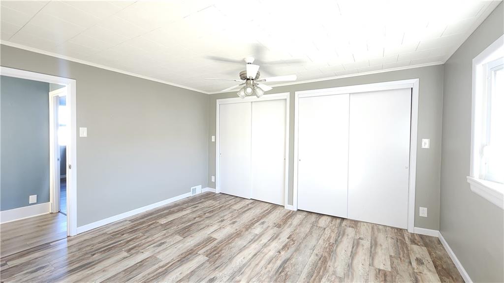 410 Longfellow Street Vandergrift, PA 15690 - Photo 18 of 25 wooden floor in an empty room with a window