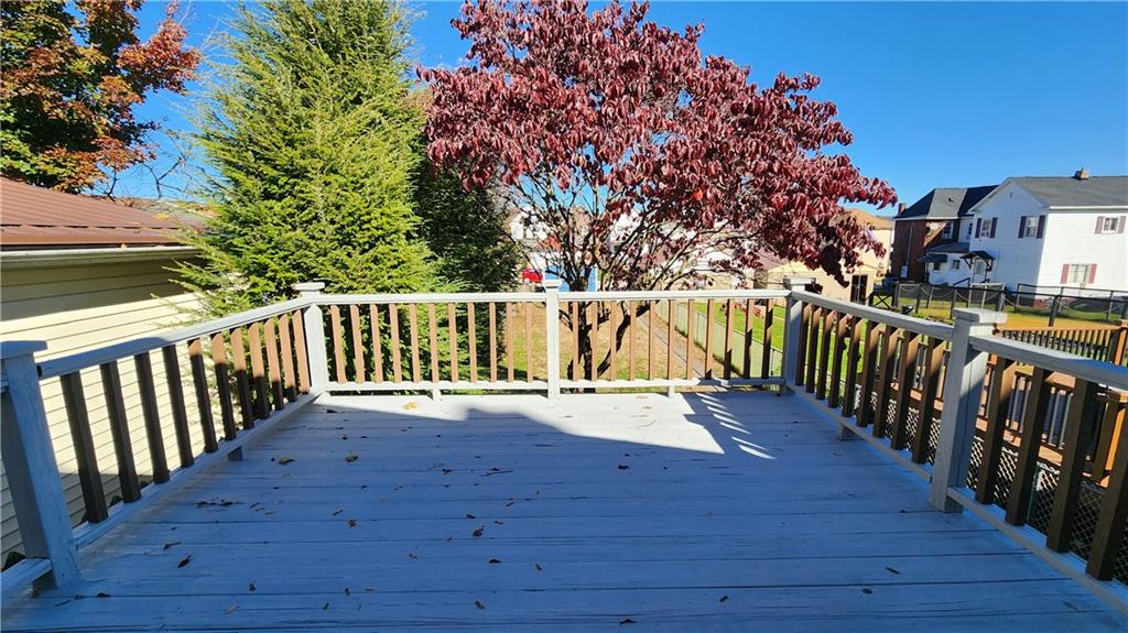 410 Longfellow Street Vandergrift, PA 15690 - Photo 22 of 25 a view of deck with wooden floor and fence
