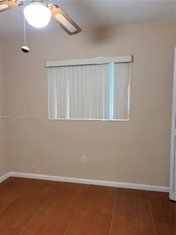 a view of an empty room with windows