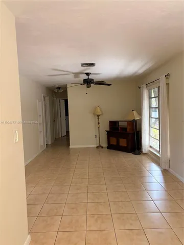 a view of a livingroom with furniture and window
