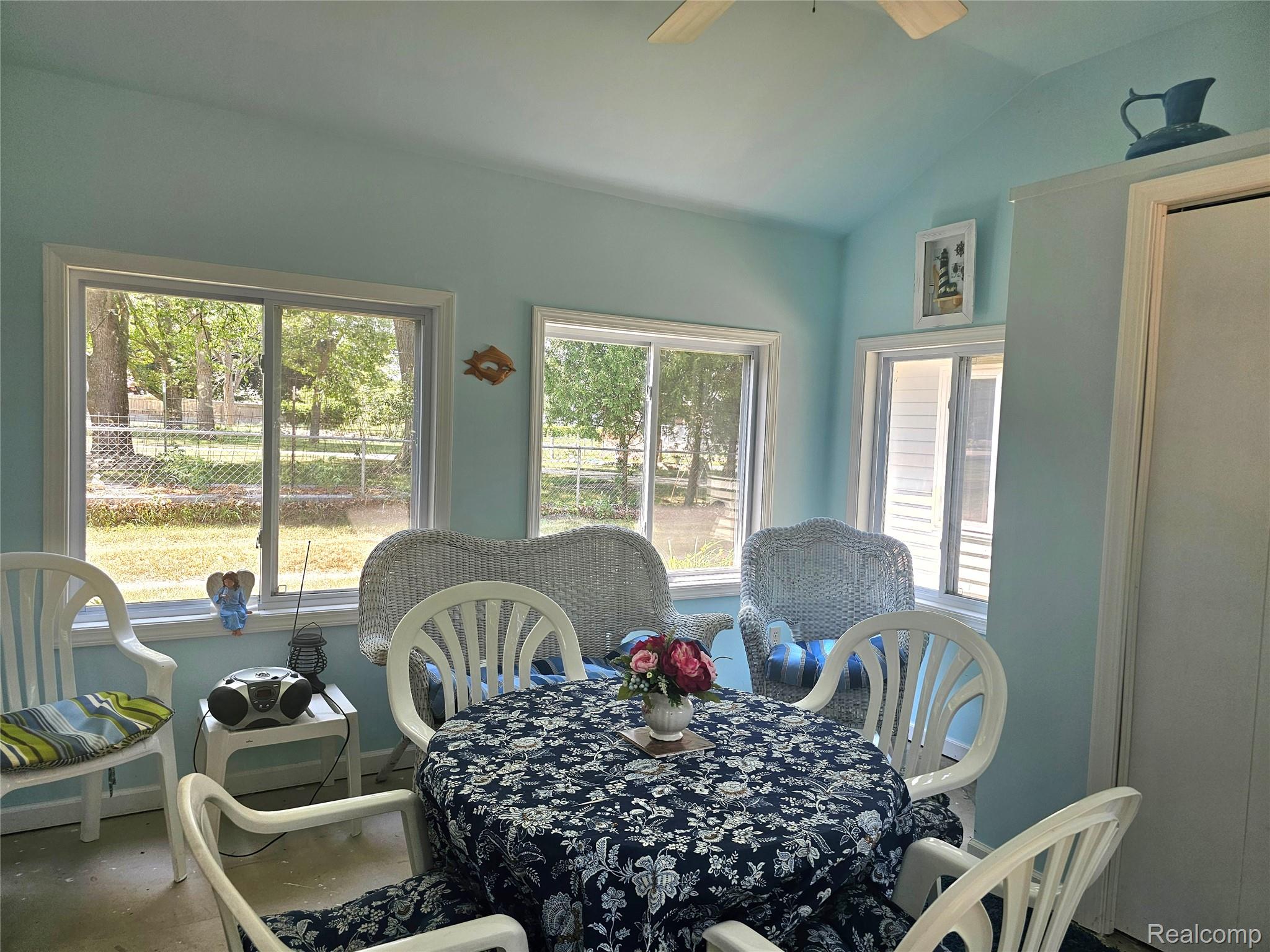 4682 Port Austin Road Caseville, MI 48725 - Photo 5 of 21 Dining area with plenty of natural light, ceiling fan, and lofted ceiling.