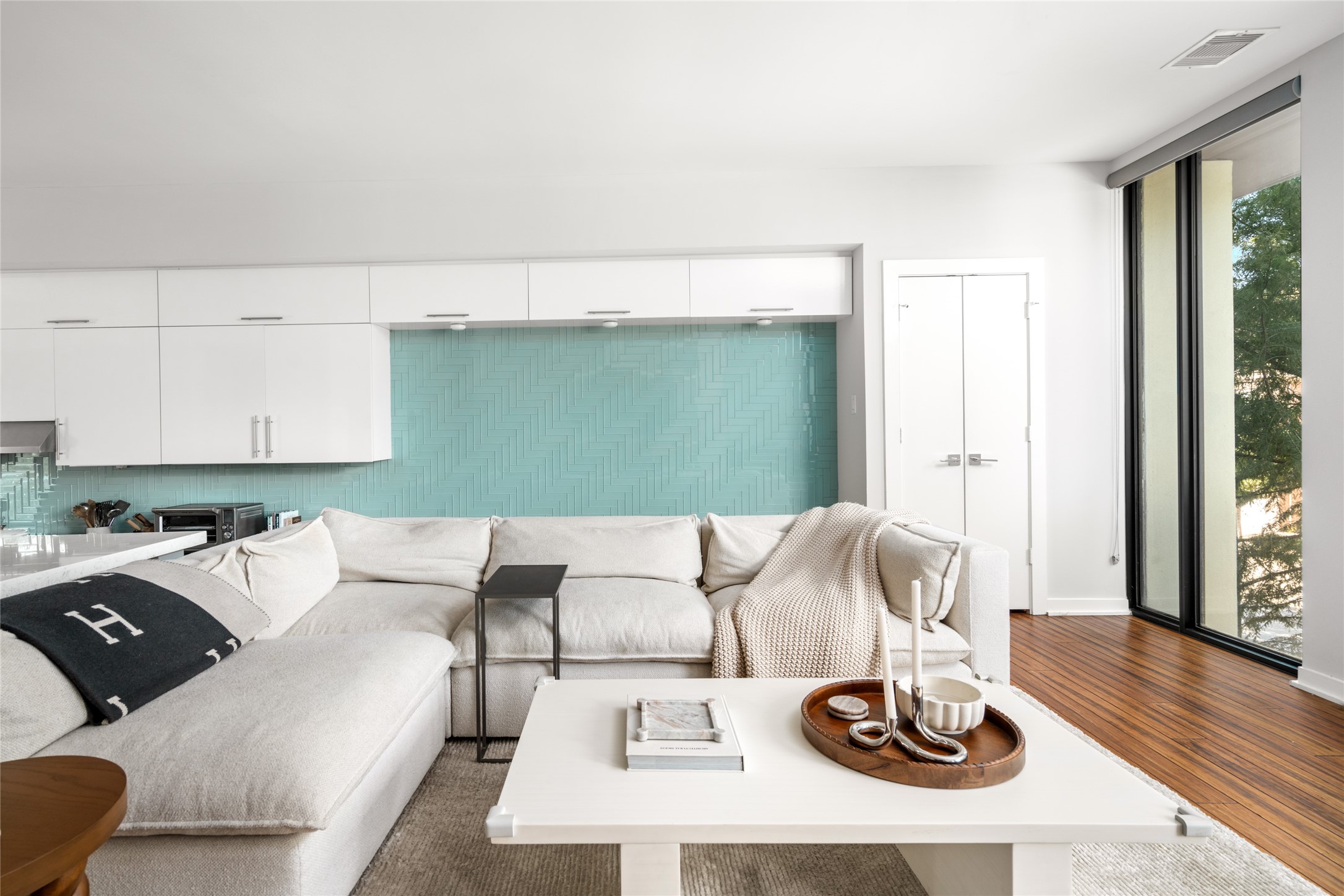 2202 Whitney Street Houston, TX 77006 - Photo 11 of 40 a living room with furniture and a wooden floor