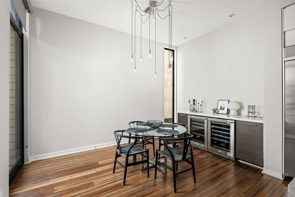 a view of a dining room with furniture and wooden floor