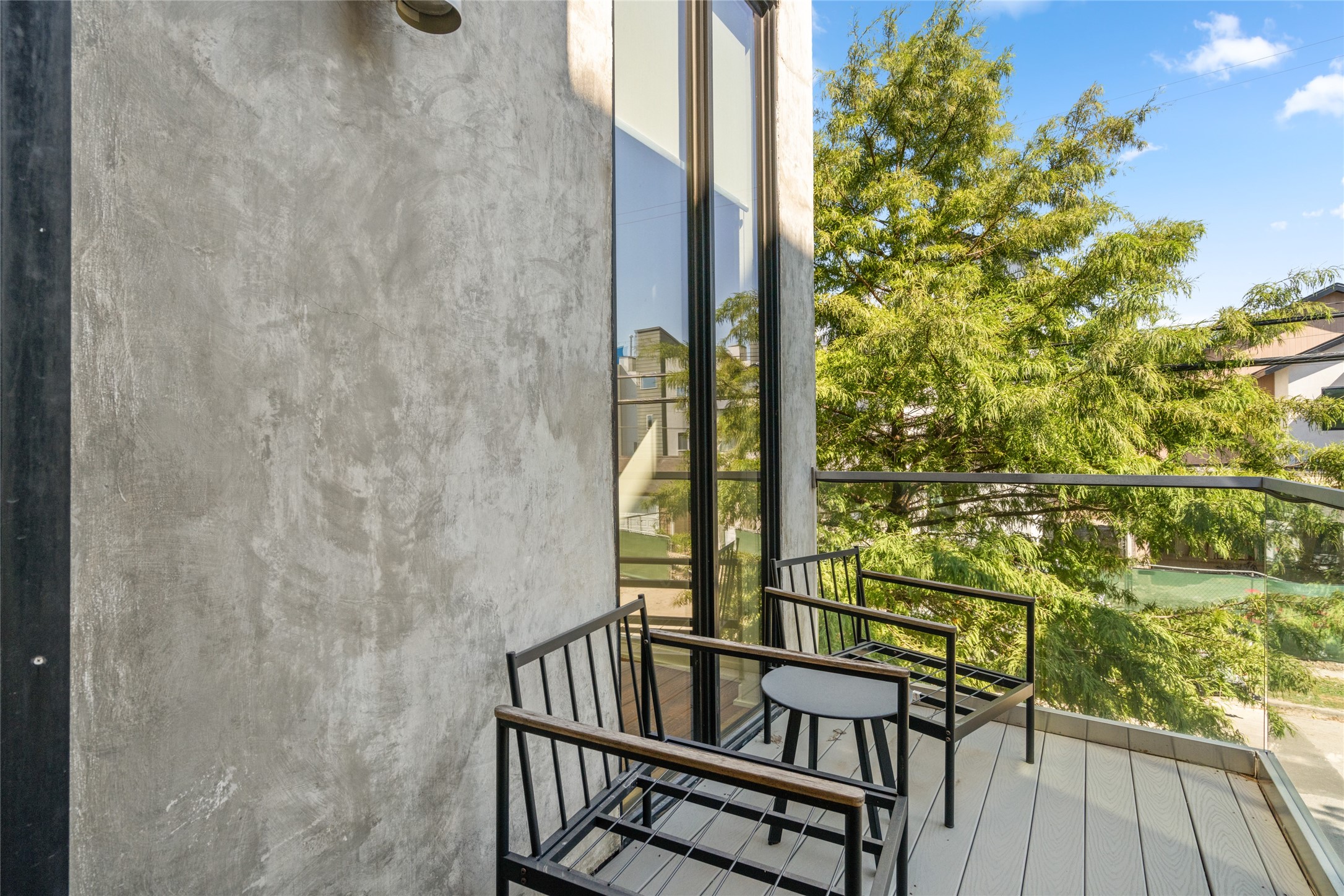 2202 Whitney Street Houston, TX 77006 - Photo 26 of 40 a view of balcony with wooden floor and outdoor seating