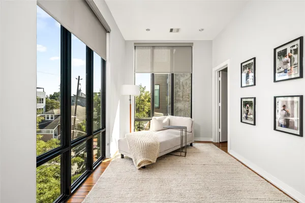 a spacious bedroom with a large bed and a large window