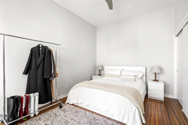 a bedroom with a bed and a walk in closet