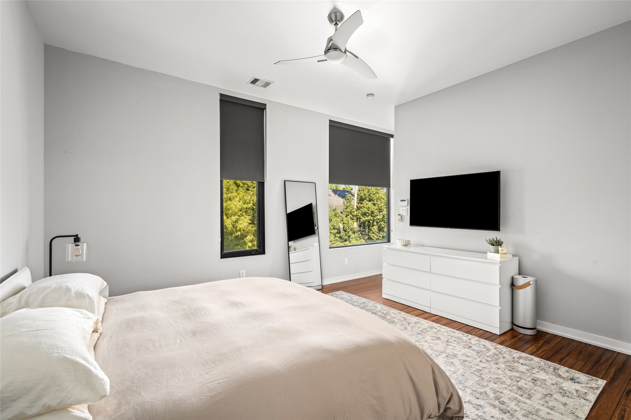 2202 Whitney Street Houston, TX 77006 - Photo 32 of 40 a bedroom with a bed and a flat screen tv