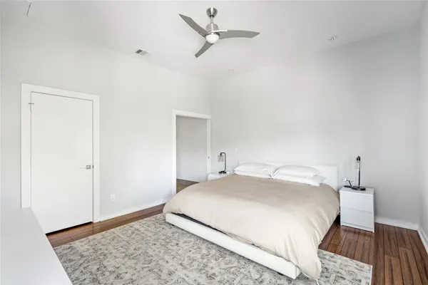 a bedroom with a bed and a table