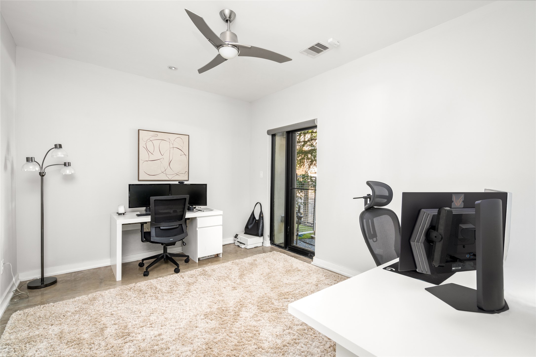 2202 Whitney Street Houston, TX 77006 - Photo 7 of 40 a view of a workspace with furniture