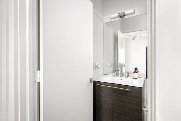 a bathroom with a sink and a mirror