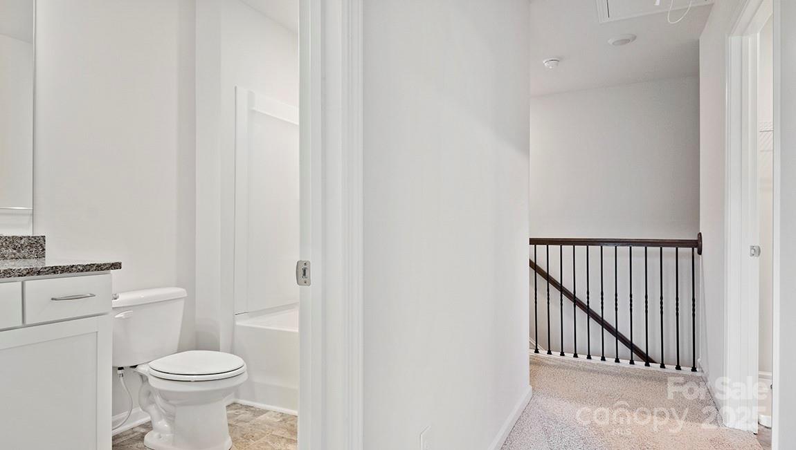 346 Creekview Road Hendersonville, NC 28792 - Photo 16 of 22 a bathroom with a toilet and a sink