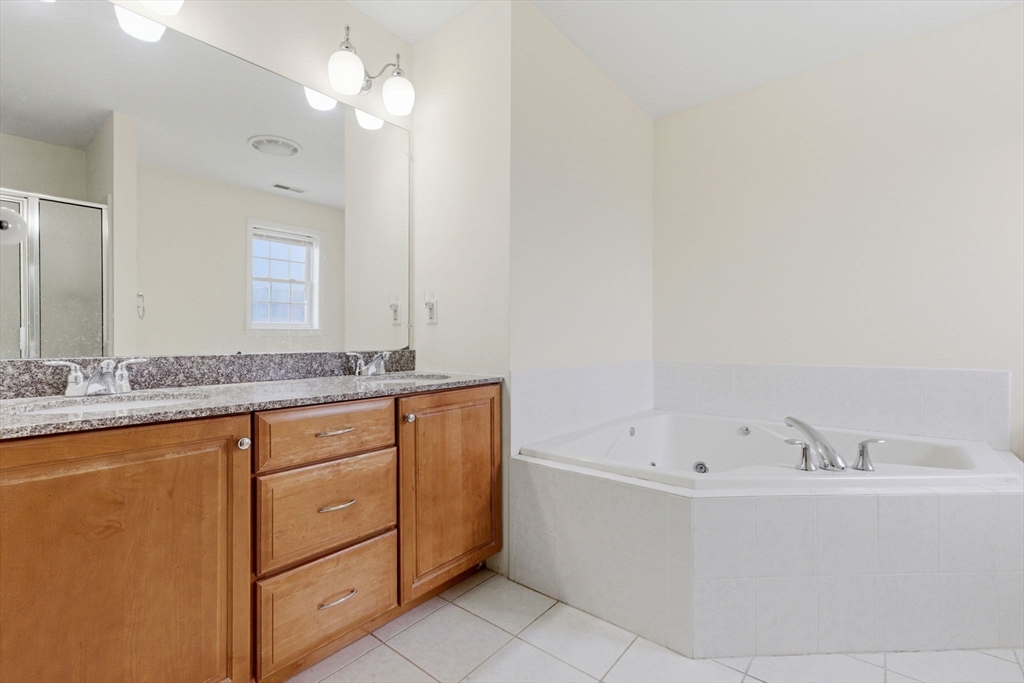 16 Windsor Road Shirley, MA 01464 - Photo 12 of 29 a bathroom with a tub sink and mirror