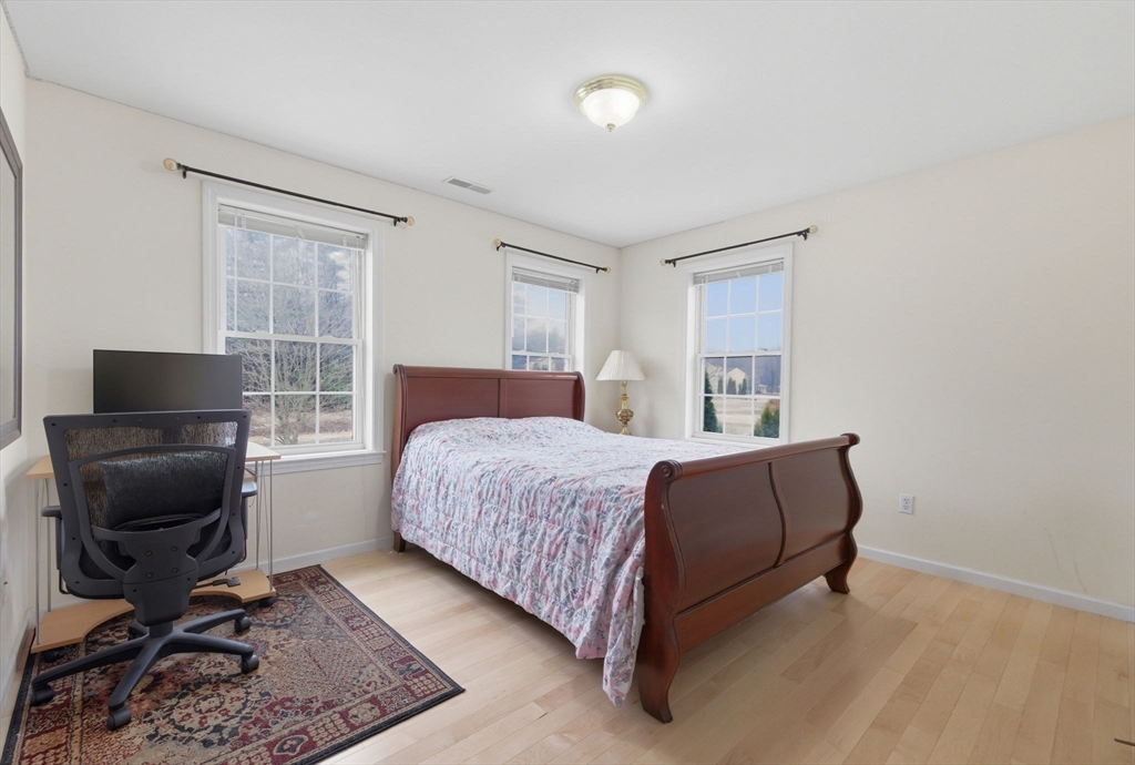 16 Windsor Road Shirley, MA 01464 - Photo 15 of 29 a bedroom with a bed and a couch