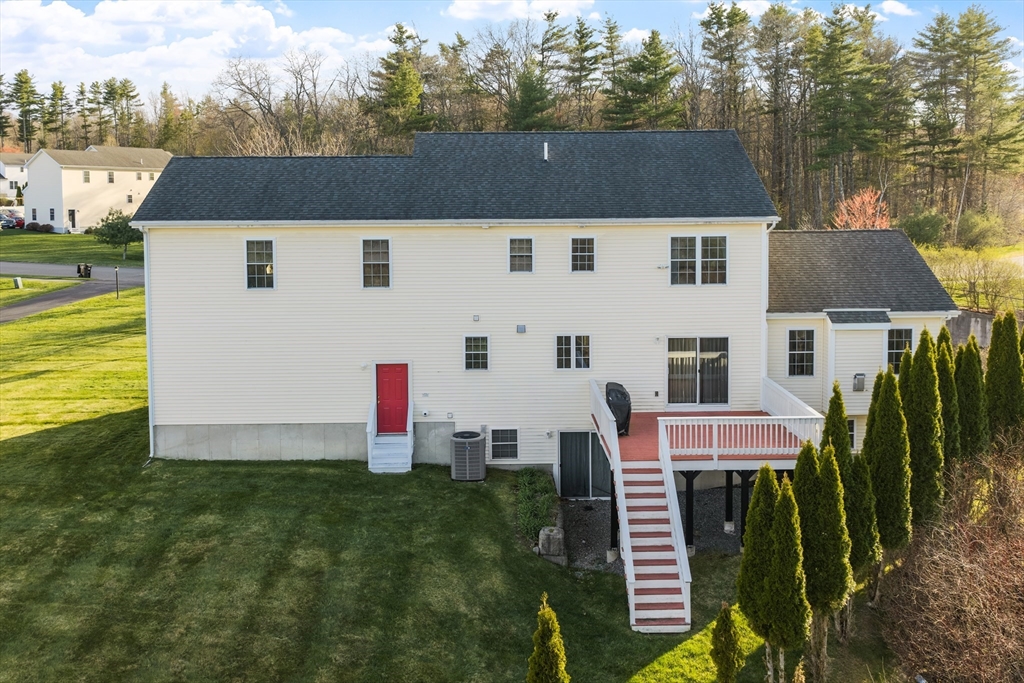 16 Windsor Road Shirley, MA 01464 - Photo 24 of 29 a aerial view of a house with table and chairs