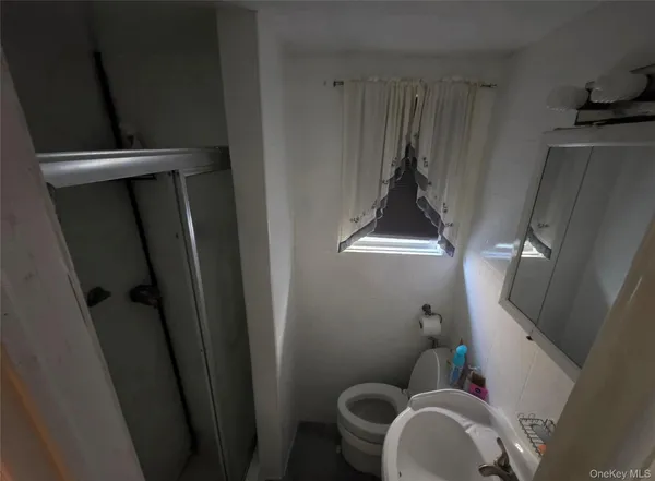 a bathroom with a sink and toilet