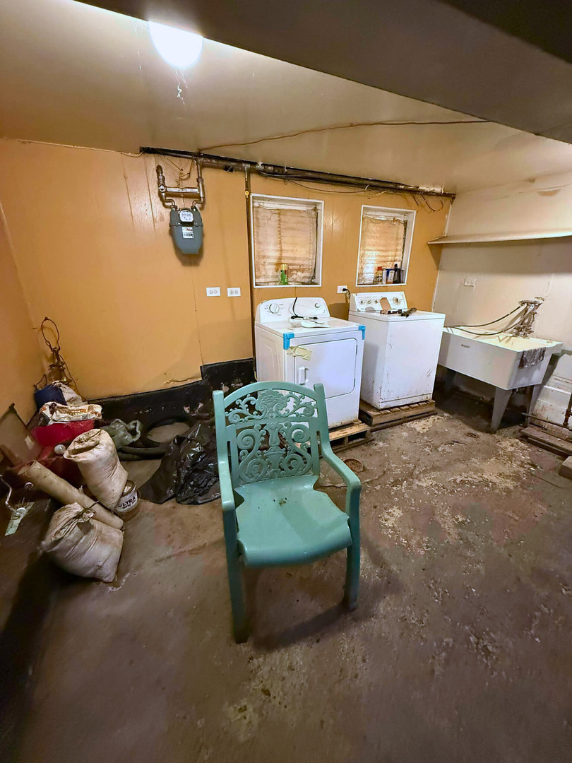 2038 West 70th Place Chicago, IL 60636 - Photo 8 of 8 a living room with furniture and a couch