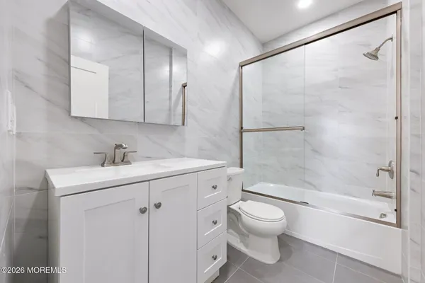 a bathroom with a toilet sink and a bathtub