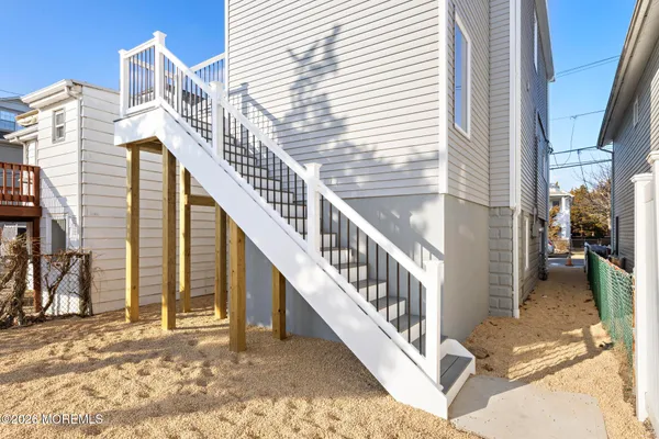 a view of a house with wooden stairs