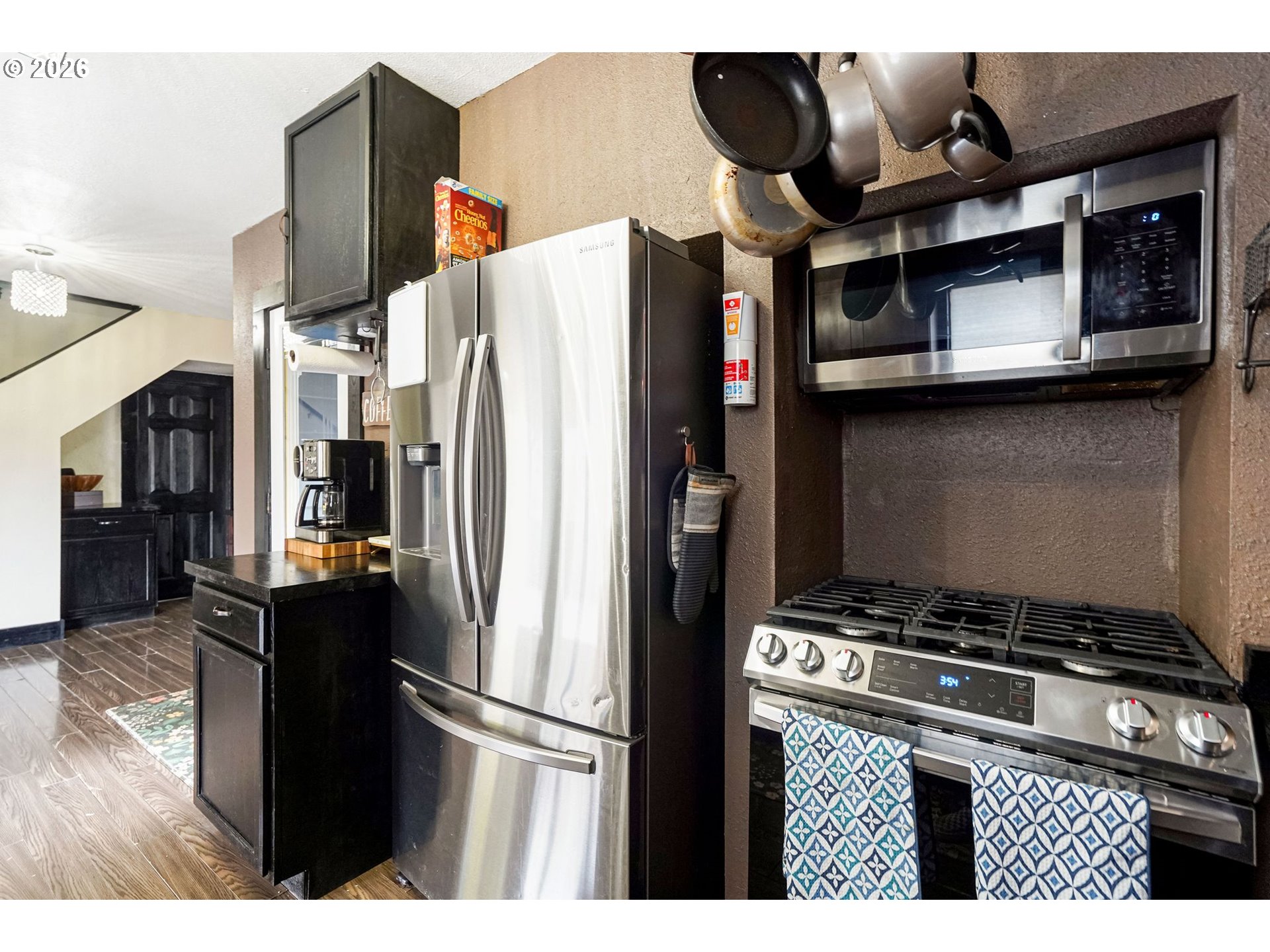 4810 Rickman Road Northeast Keizer, OR 97303 - Photo 13 of 42 a kitchen with stainless steel appliances granite countertop a refrigerator and a stove