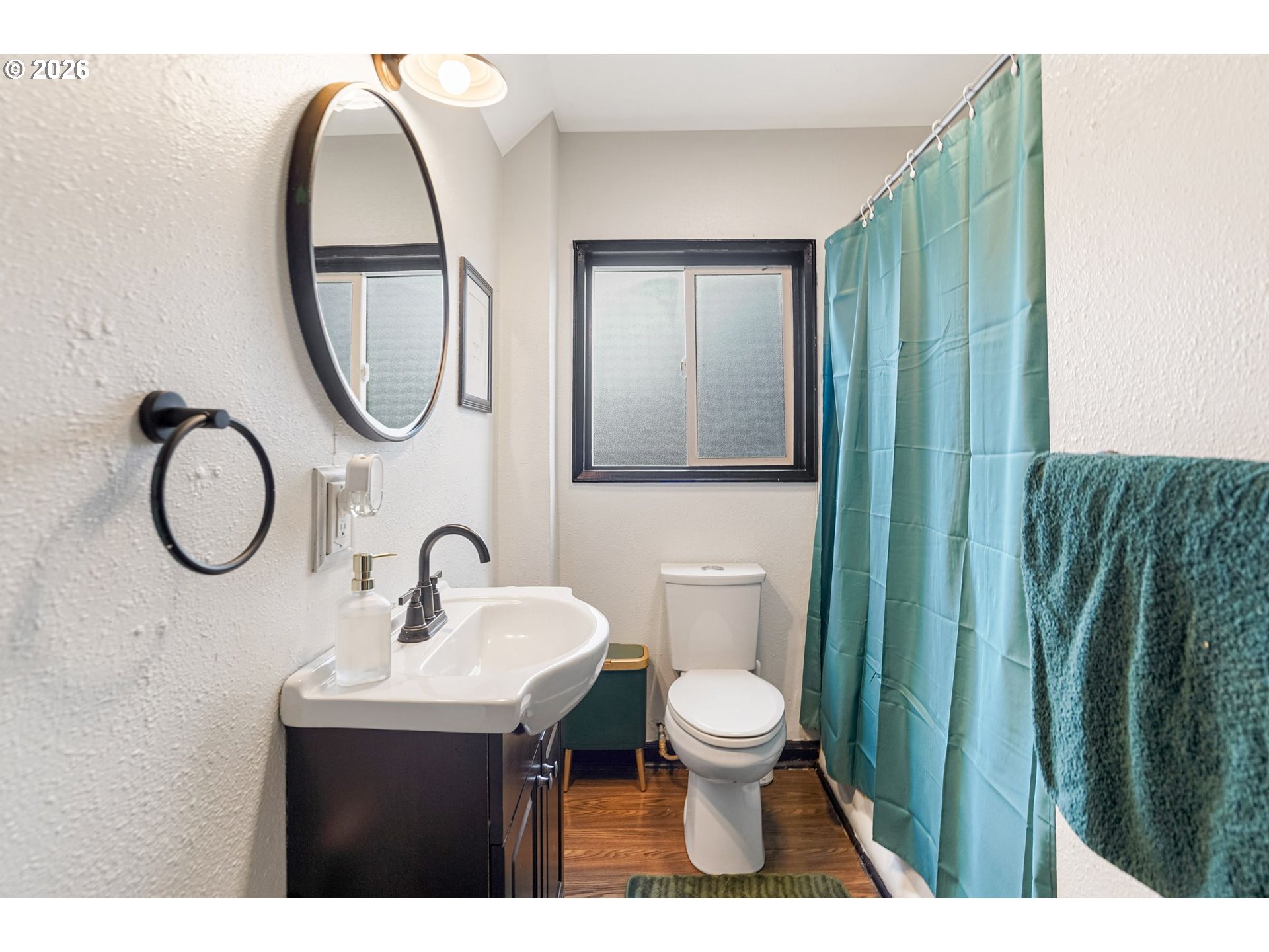 4810 Rickman Road Northeast Keizer, OR 97303 - Photo 26 of 42 a bathroom with a sink mirror and toilet