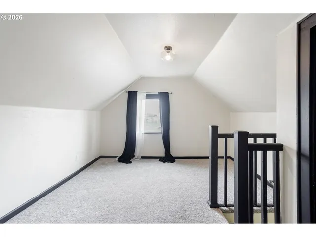 a view of an empty room with stairs