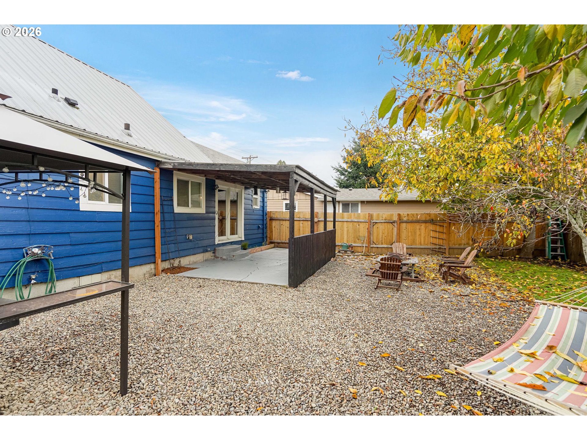 4810 Rickman Road Northeast Keizer, OR 97303 - Photo 40 of 42 a backyard of a house with barbeque oven table and chairs