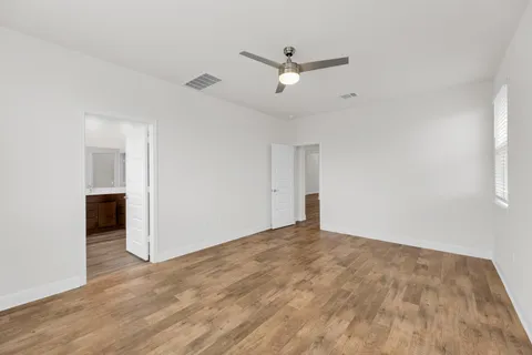 a kitchen with stainless steel appliances granite countertop a stove sink and cabinets