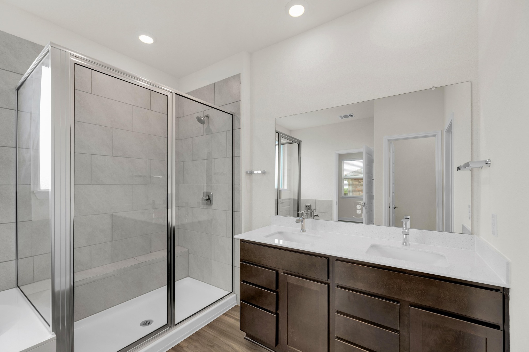 16817 Ponte Cove Pflugerville, TX 78660 - Photo 17 of 36 a bathroom with a shower sink and mirror