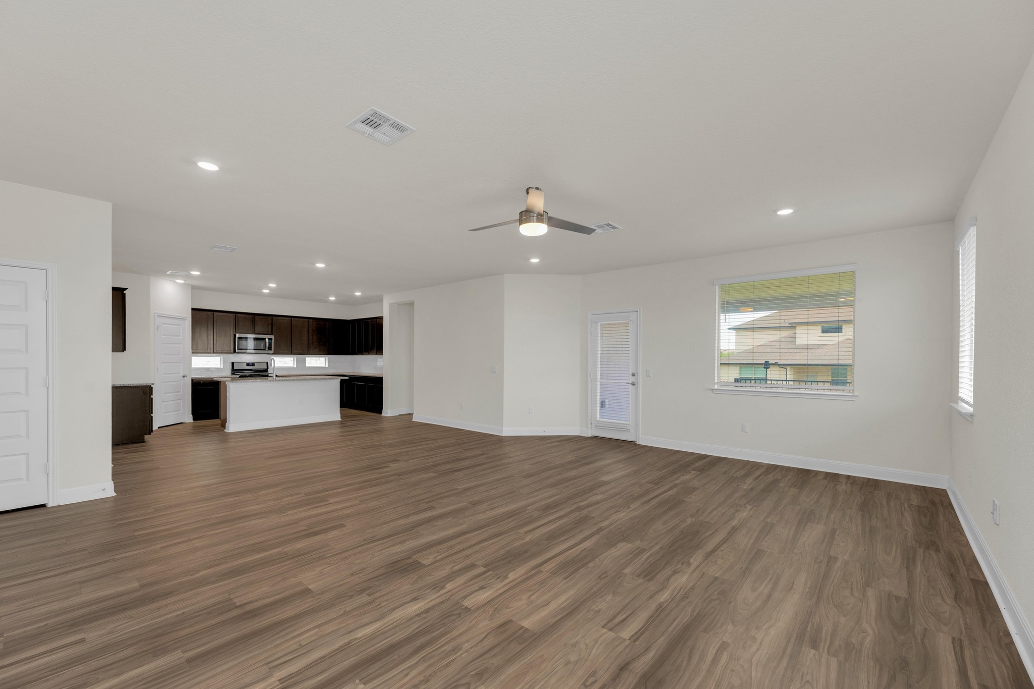 16817 Ponte Cove Pflugerville, TX 78660 - Photo 34 of 36 a view of kitchen and hall with wooden floor