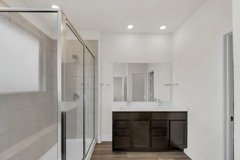a bathroom with a bathtub and a shower