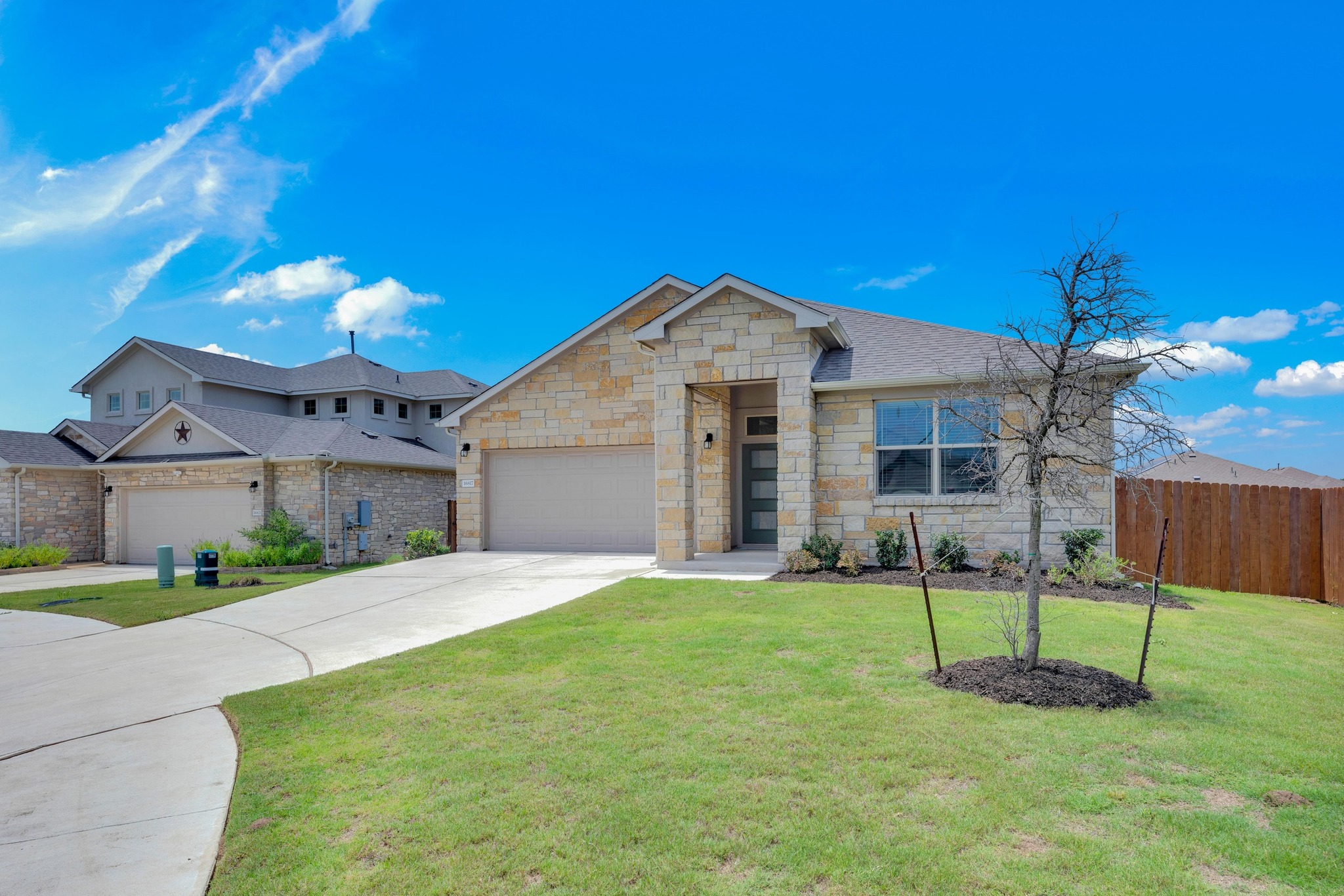 16817 Ponte Cove Pflugerville, TX 78660 - Photo 33 of 36 a front view of a house with a yard and garage