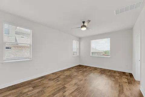 a kitchen with stainless steel appliances granite countertop a sink refrigerator and cabinets