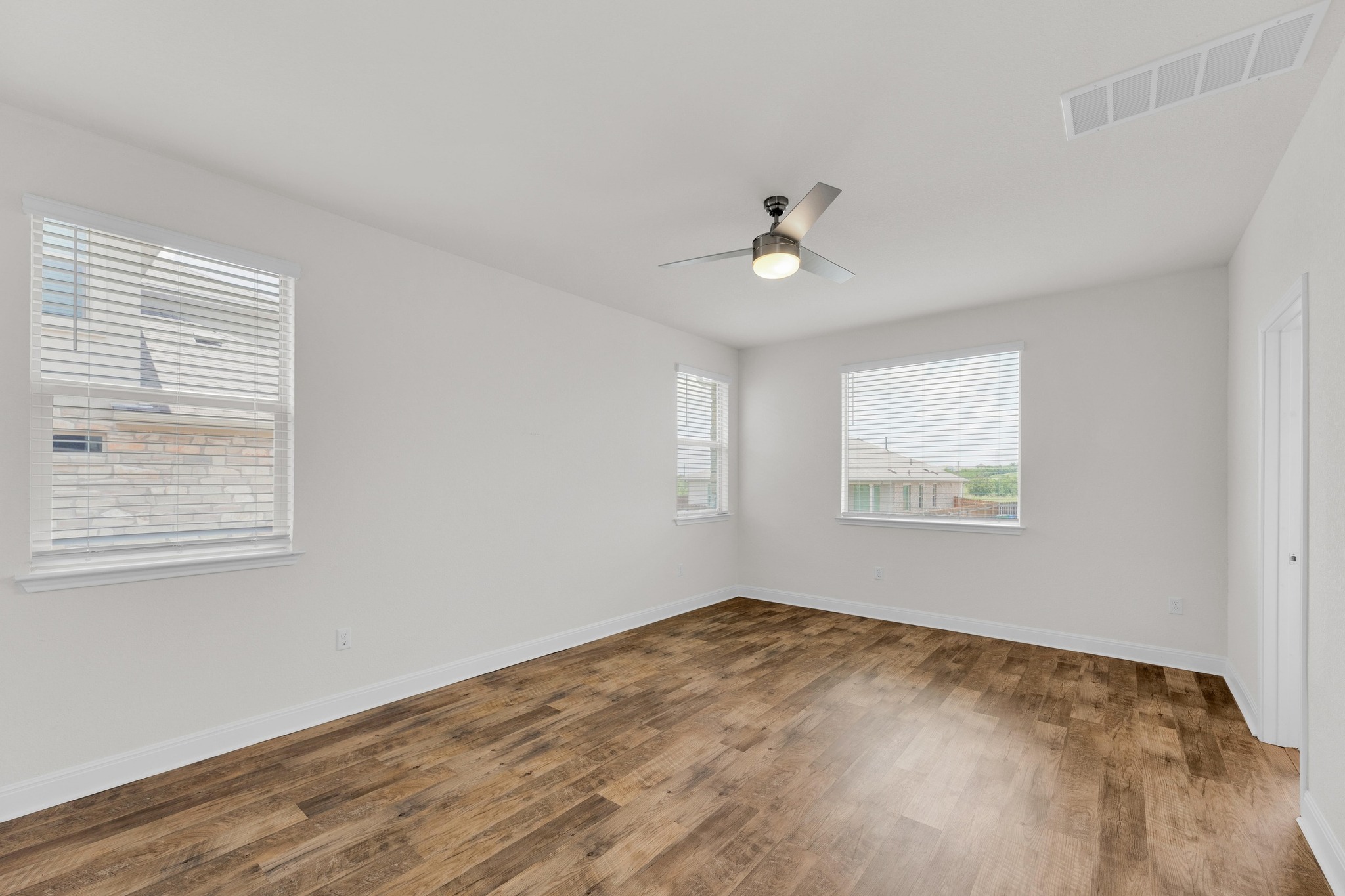 16817 Ponte Cove Pflugerville, TX 78660 - Photo 3 of 36 a view of empty room with windows
