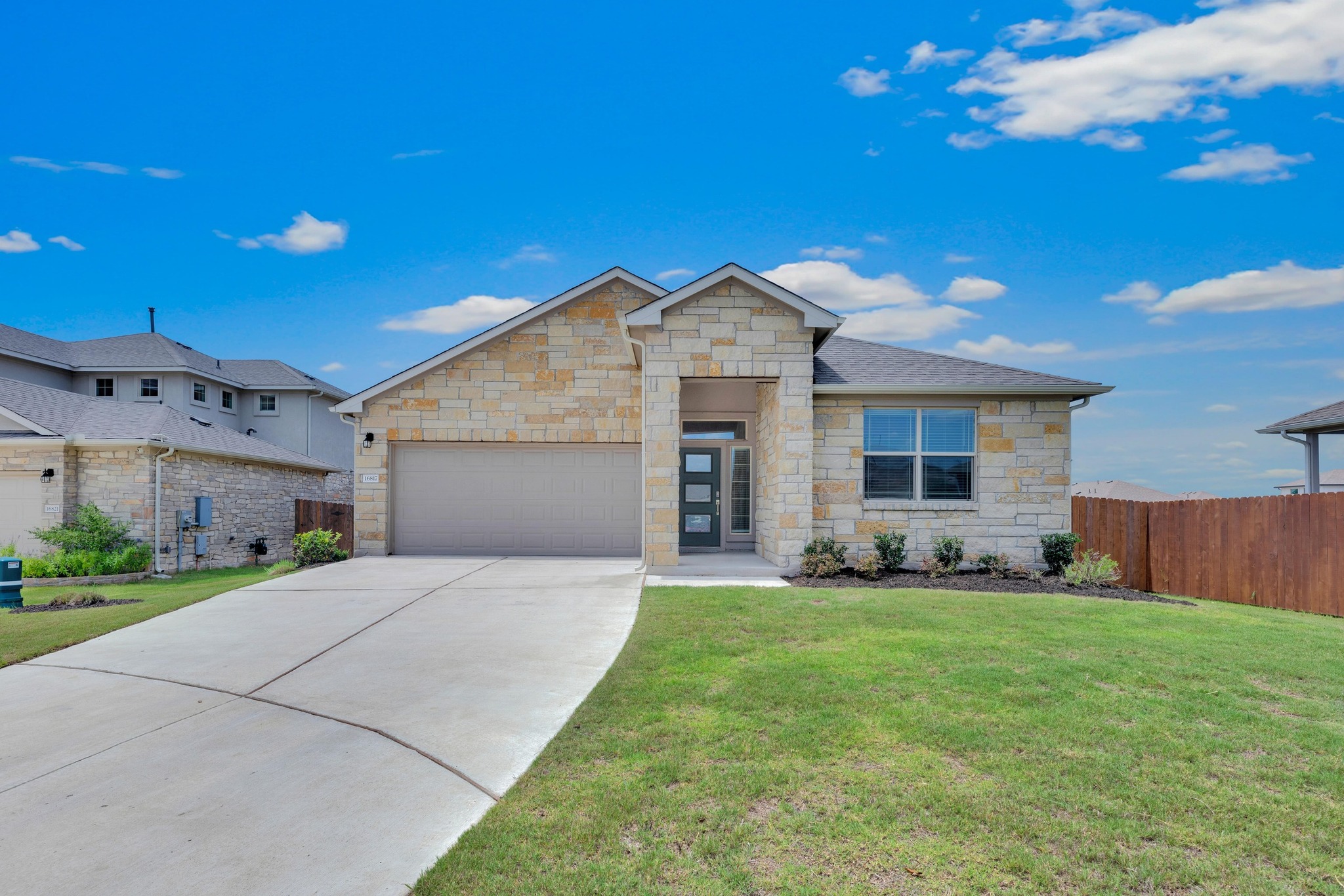 16817 Ponte Cove Pflugerville, TX 78660 - Photo 5 of 36 a front view of house with yard and green space