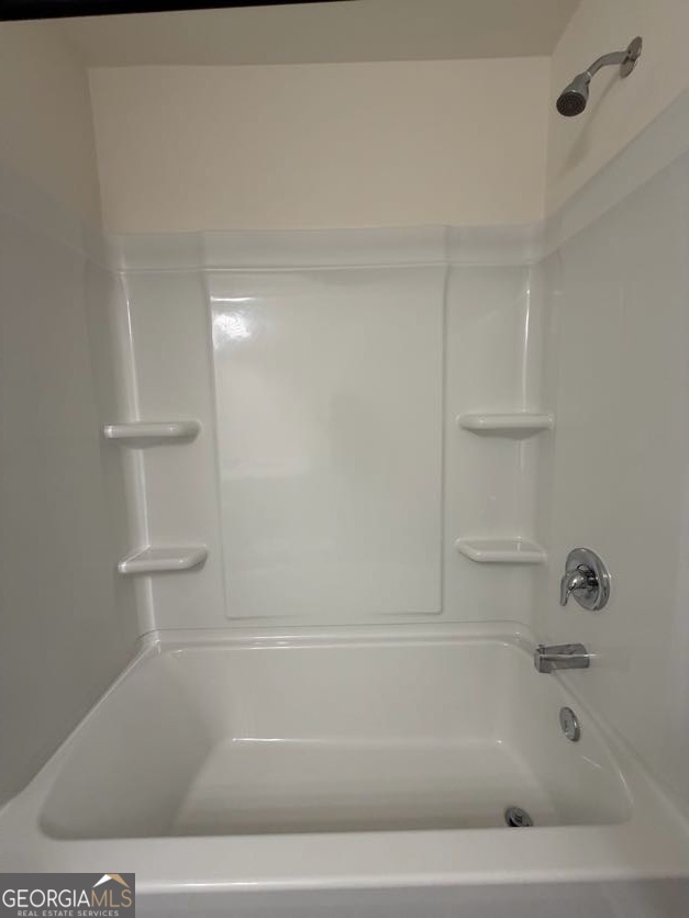 35300 Condor Court Southwest Atlanta, GA 30331 - Photo 23 of 31 a bathroom with a bathtub