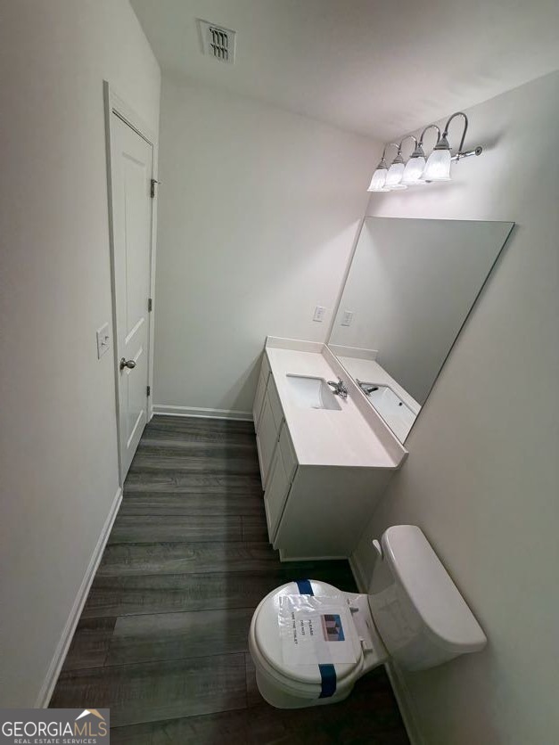 35300 Condor Court Southwest Atlanta, GA 30331 - Photo 24 of 31 a bathroom with a sink mirror and toilet