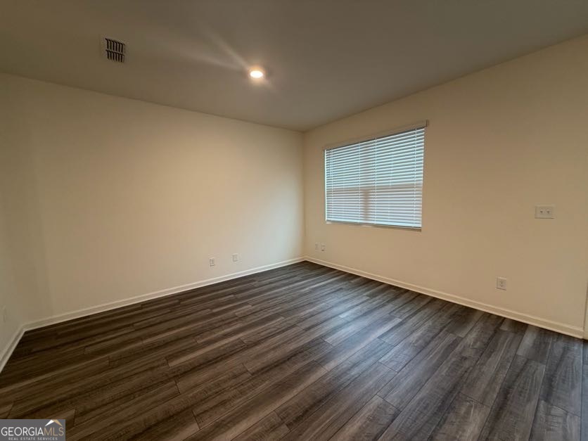 35300 Condor Court Southwest Atlanta, GA 30331 - Photo 3 of 31 a view of an empty room with wooden floor and a window