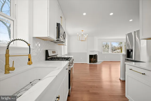 a kitchen with a stove and a refrigerator