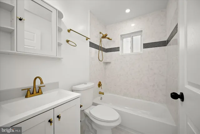 a view of a patio with a table and chairs under an umbrella